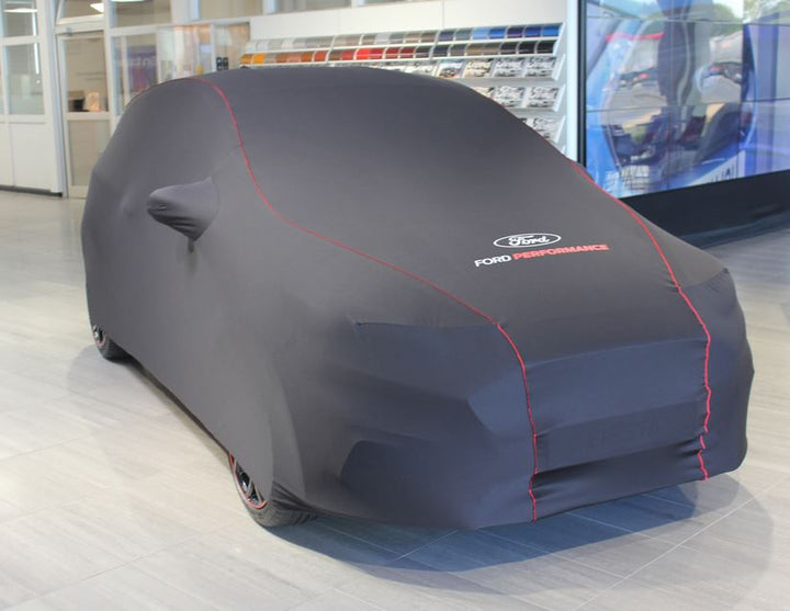 Housse de protection premium noir avec garnissage rouge, ovale Ford blanc et logo Ford Performance